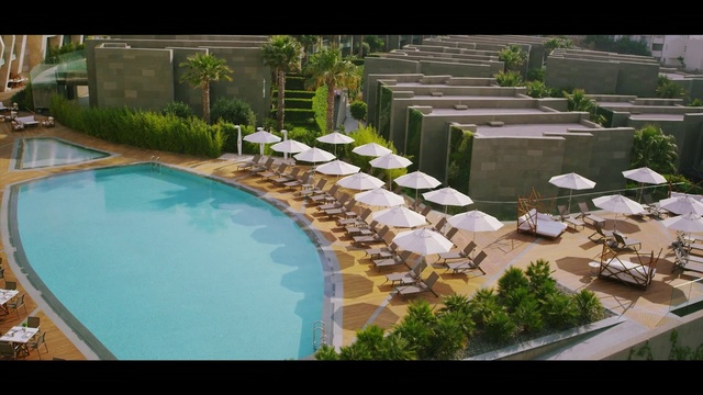 Video Reference: Swimming pool, Resort, Backyard, Landscape, Landscaping, Real estate, Urban design, Residential area, Leisure, Water feature