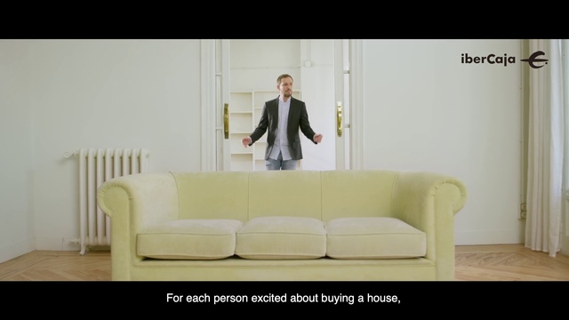Video Reference: Couch, Furniture, Sitting, Sofa bed, Room, Design, Gentleman, Formal wear, Suit, Table, Person, Indoor, Living, Sofa, Man, Standing, White, Holding, Television, Woman, Large, Wall, Floor, Chair, Studio couch, Clothing, Coffee table, Loveseat, Footwear, Seat