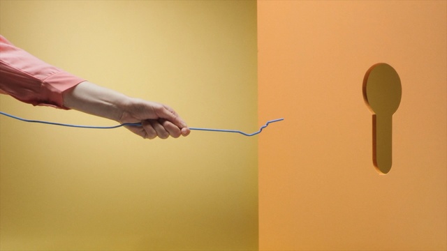 Video Reference: yellow, arm, hand, line, finger, material, angle, Person