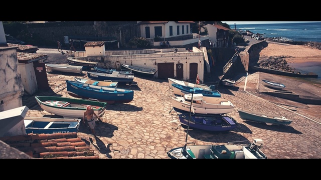 Video Reference: Sky, Harbor, Vehicle, Boat, Architecture, Landscape, City, Sea, Port, House, Person