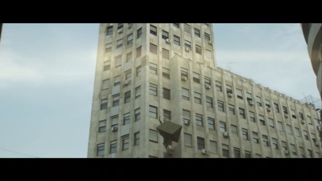 Video Reference: building, skyscraper, landmark, condominium, residential area, tower block, metropolis, sky, urban area, commercial building, Person