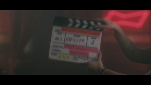 Video Reference: Text, Font, Red, Brown, Pink, Close-up, Automotive exterior, Finger, Vehicle registration plate, Label