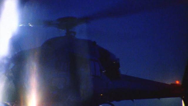 Video Reference: Helicopter, Aviation, Rotorcraft, Aerospace engineering, Aircraft, Vehicle, Sky, Air force, Atmosphere, Helicopter rotor, Outdoor, Light, Traffic, Dark, Street, Night, Plane, Red, Blurry, Lit, Yellow, Large, Stop, Man, Sun, Rain, Driving, City, Bus, Airplane, Sign, Blue