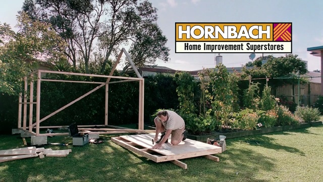 Video Reference: shed, tree, plant, backyard, outdoor structure, grass, roof, house, yard, land lot