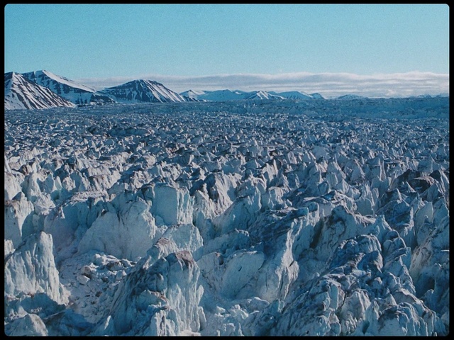 Video Reference: Mountainous landforms, Mountain range, Mountain, Glacier, Glacial landform, Alps, Sky, Badlands, Aerial photography, Massif