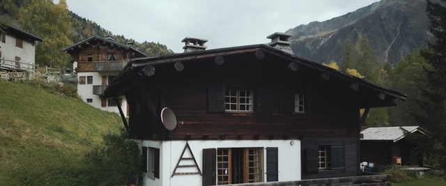 Video Reference: property, house, building, mountain range, mountain, home, cottage, facade, roof, alps