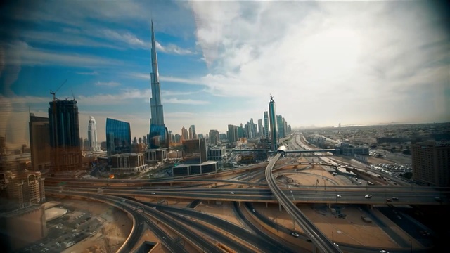 Video Reference: Cityscape, Metropolitan area, Urban area, City, Metropolis, Skyline, Sky, Skyscraper, Human settlement, Highway, Person