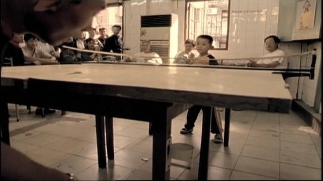 Video Reference: table, furniture, indoor games and sports, floor, flooring, Person