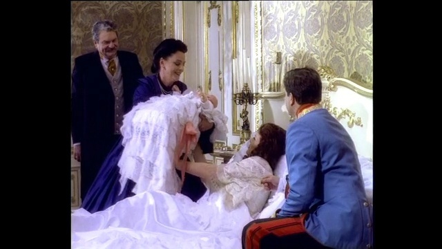 Video Reference: gown, photograph, woman, wedding dress, bridal clothing, bride, marriage, dress, man, ceremony, Person