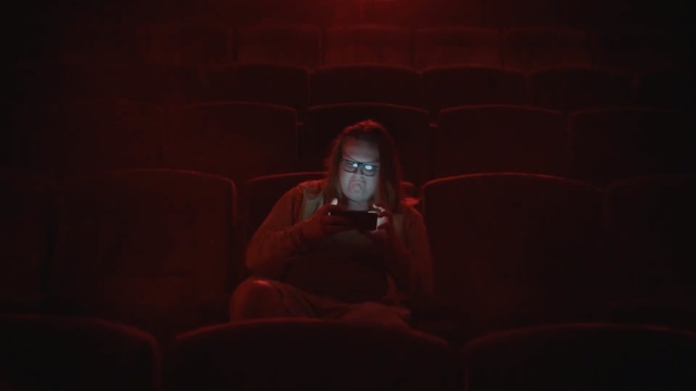 Video Reference: Red, Black, Darkness, Light, Head, Maroon, Sitting, Human, Photography, Sky, Indoor, Laptop, Room, Man, Dark, Looking, Bed, Lamp, Television, Computer, Lit, Phone, Orange, Holding, Cat, Dog, Laying, Woman, Living, Bus, Human face, Person, Screenshot, Clothing