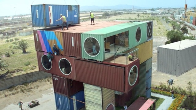 Video Reference: roof, facade, product, shipping container, vehicle, Person