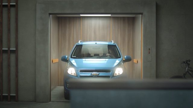 Video Reference: Land vehicle, Car, Vehicle, Automotive design, City car, Parking, Chevrolet, Architecture, Vehicle door, Hatchback