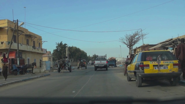 Video Reference: Motor vehicle, Mode of transport, Transport, Road, Lane, Vehicle, Town, Thoroughfare, Street, Neighbourhood