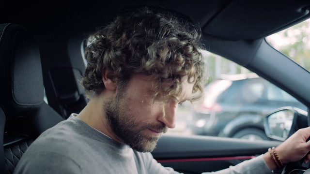 Video Reference: Driving, Automotive window part, Facial hair, Vehicle, Windshield, Car, Automotive exterior, Photography, Auto part, Family car