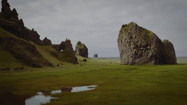 Video Reference: highland, rock, terrain, grass, cliff, sky, national trust for places of historic interest or natural beauty, escarpment, landscape, hill