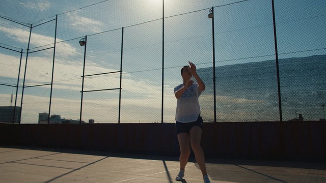 Video Reference: net, sky, sports, structure, standing, recreation, sport venue, girl, fun, line