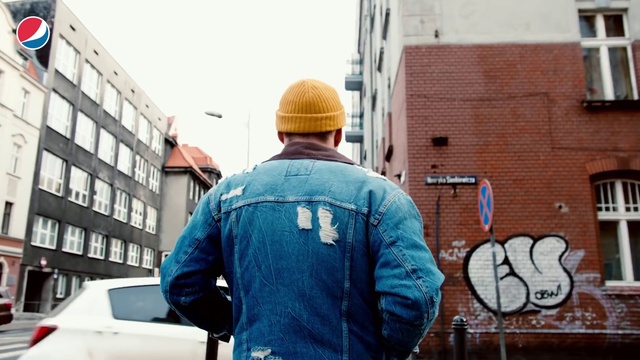 Video Reference: Wall, Workwear, Blue-collar worker, Jacket, Headgear, Mural, Outerwear, Art, Street fashion, Street art