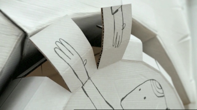 Video Reference: cardboard, design, paper, font, angle, material, product, box, carton, Person