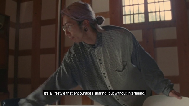 Video Reference: Shoulder, Outerwear, Joint, Neck, Human, Photo caption, Muscle, Sitting, Photography, Sleeve, Person, Indoor, Man, Table, Window, Looking, Food, Front, Holding, Standing, Young, Laptop, Kitchen, Plate, Computer, Cake, Black, Woman, Shirt, Room, Birthday, Pizza, Eating, Restaurant, People, Remote, White, Playing, Wall, Human face, Clothing, Glasses, Screenshot, Text