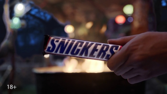 Video Reference: Blue, Font, Hand, Photography, Confectionery, Chocolate bar, Snickers