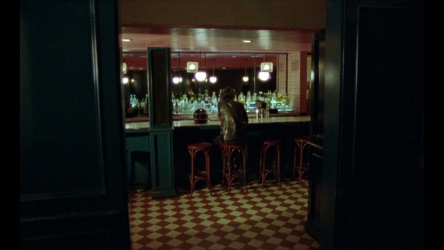 Video Reference: Building, Room, Restaurant, Night, Indoor, Cabinet, Kitchen, Refrigerator, Window, Table, Sitting, Small, Door, Living, View, White, Standing, Large, Red, Oven, Fire, Stove, Floor, Furniture, Bar, Chair, Person, Menu, Kitchen & dining room table, Dining table