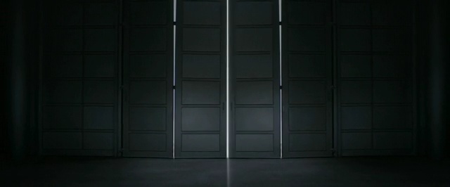 Video Reference: black, light, darkness, wall, structure, door, window, wood, floor, daylighting, Person