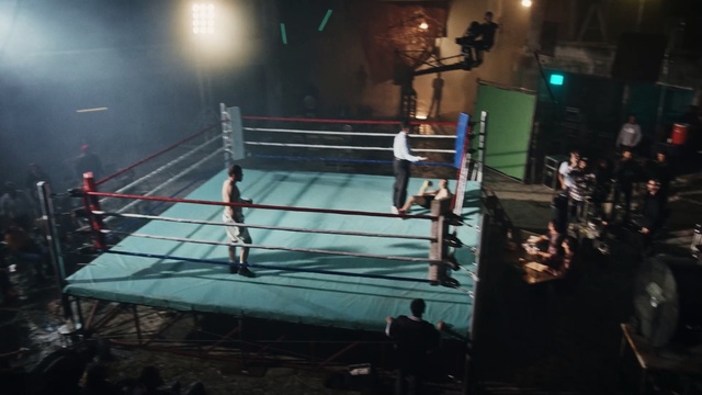 Video Reference: Sport venue, Boxing ring, Contact sport, Boxing, Striking combat sports, Boxing equipment, Sky, Individual sports, Combat sport, Professional wrestling, Person