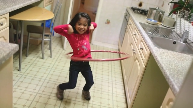 Video Reference: Hula hoop, Leg, Room, Fun, Toy, Play, Child, Floor, Leisure, Flooring, Person