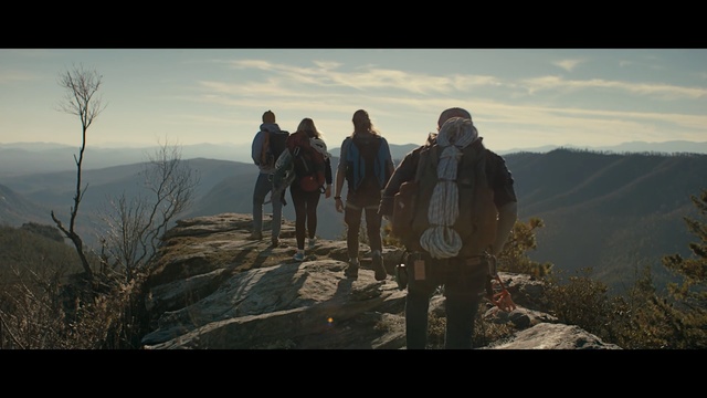 Video Reference: mountainous landforms, mountain, wilderness, sky, ridge, outdoor recreation, screenshot, adventure, mountain range, summit, Person