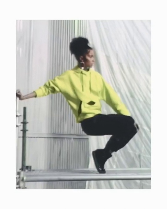 Video Reference: Yellow, Clothing, Standing, Sportswear, Outerwear, Sleeve, Tights, Joint, Leg, Shoulder