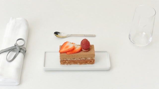 Video Reference: dessert, cutlery, sweetness, spoon, tableware, petit four, Person