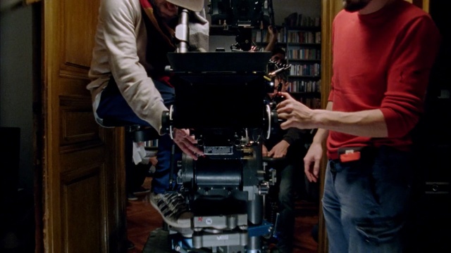Video Reference: filmmaking, cinematographer, technology, electronic device, camera operator, camera accessory, electronics, machine, film crew, Person