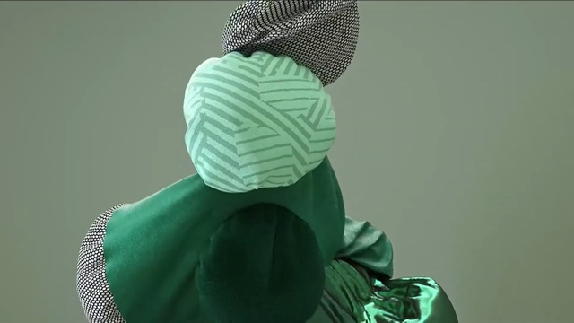 Video Reference: green, headgear, cap, beanie, Person