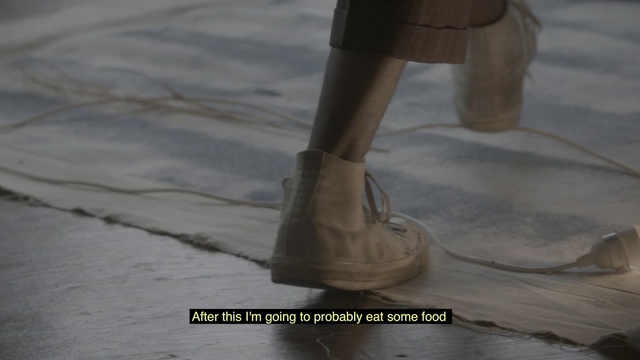 Video Reference: footwear, shoe, floor, flooring, outdoor shoe, Person