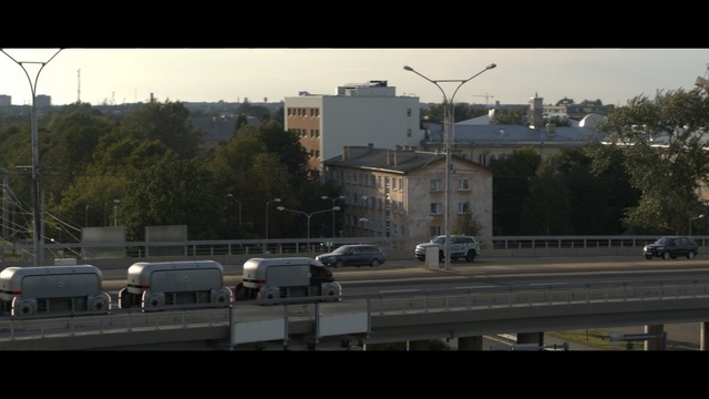 Video Reference: car, sky, transport, residential area, urban area, road, suburb, town, vehicle, track
