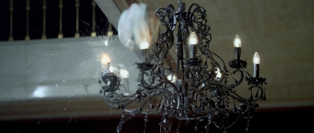 Video Reference: light fixture, chandelier, lighting, lighting accessory, decor, darkness, incandescent light bulb, space, Person