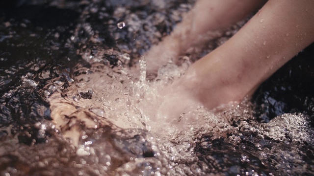 Video Reference: Water, Soil, Mud, Close-up, Hand, Leg, Geological phenomenon, Rock, Foot