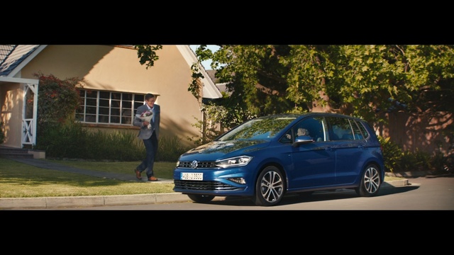 Video Reference: car, motor vehicle, blue, vehicle, family car, automotive design, full size car, road trip, mid size car, transport, Person