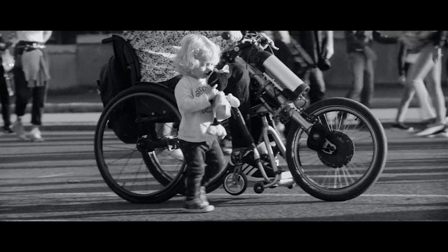 Video Reference: Land vehicle, Vehicle, Bicycle, Motor vehicle, Motorcycle, Mode of transport, Black-and-white, Bicycle wheel, Photography, Spoke