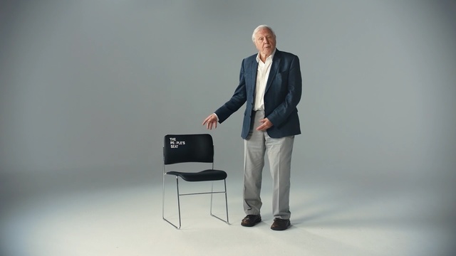 Video Reference: Standing, Sitting, Furniture, Design, Suit, Public speaking, Businessperson, Event, White-collar worker, Orator