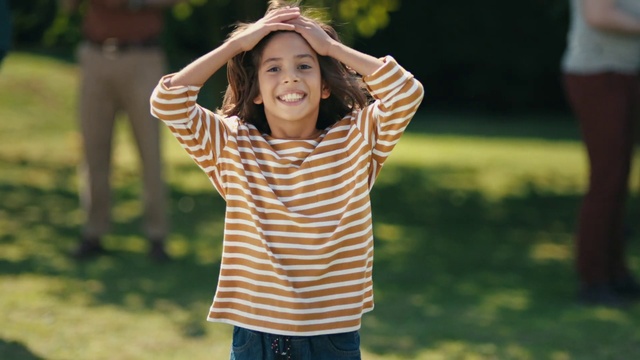 Video Reference: Facial expression, People, Smile, Fun, Yellow, Happy, Child, Grass, Arm, Shoulder