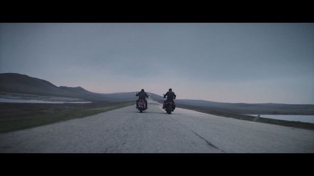 Video Reference: road, sky, mode of transport, sea, road trip, terrain, vehicle, cloud, horizon, mountain
