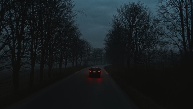 Video Reference: Sky, Atmospheric phenomenon, Black, Road, Mode of transport, Tree, Automotive lighting, Darkness, Morning, Night