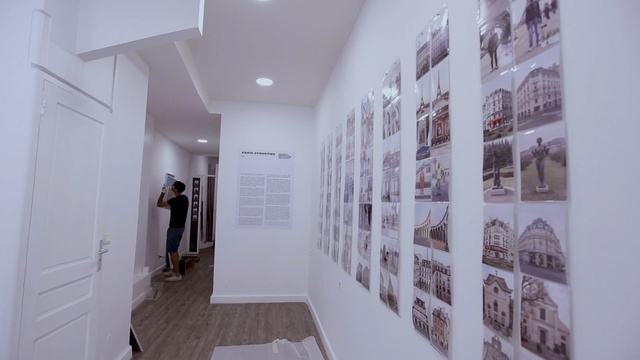 Video Reference: exhibition, art exhibition, interior design, design, flooring, art gallery, floor, ceiling, apartment, hall, Person