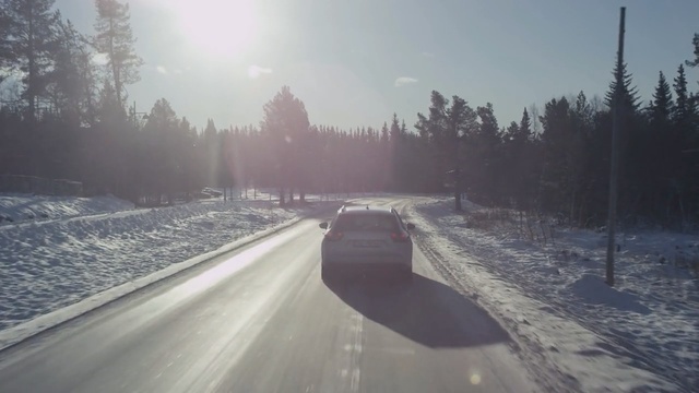 Video Reference: road, snow, winter, freezing, sky, morning, tree, highway, sunlight, geological phenomenon