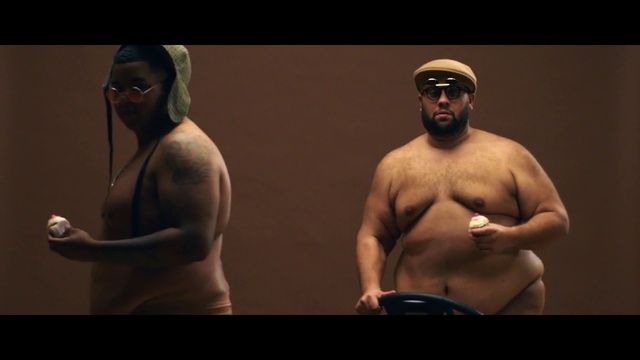 Video Reference: Barechested, Chest, Muscle, Male, Arm, Human, Abdomen, Human body, Trunk, Flesh, Person, Indoor, Man, Standing, Holding, Looking, Playing, Game, Woman, Ball, Video, Player, Room, People, Text, Human face, Bodybuilder, Bodybuilding, Shirtless, Chest hair