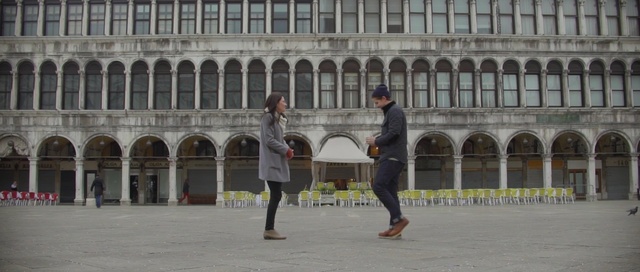 Video Reference: building, plaza, tourist attraction, city, town square, tourism, facade, recreation, pedestrian, Person