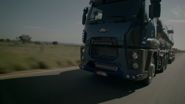 Video Reference: motor vehicle, transport, vehicle, truck, commercial vehicle, mode of transport, automotive tire, road, automotive exterior, automotive wheel system, Person