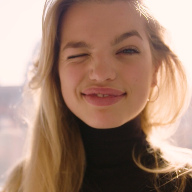 Video Reference: face, eyebrow, human hair color, beauty, cheek, blond, chin, lip, smile, forehead, Person