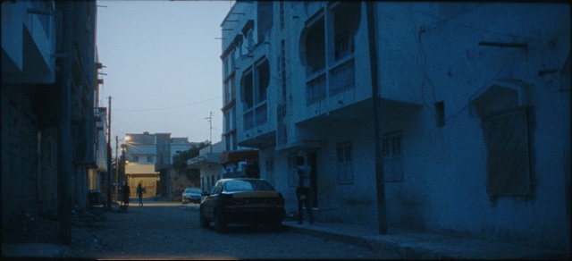 Video Reference: Blue, Mode of transport, Vehicle, Urban area, Neighbourhood, Car, Town, Street, Road, Architecture